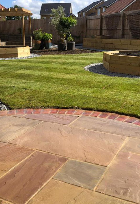 Traditional brick edged patio